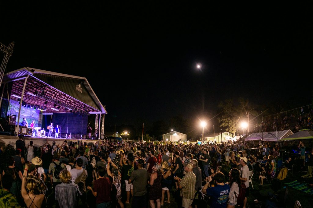 Crowd watching the mainstage act at the Watermelon Pickers' Fest at night