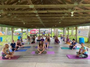 People doing Yoga in the Pick-nic shelter