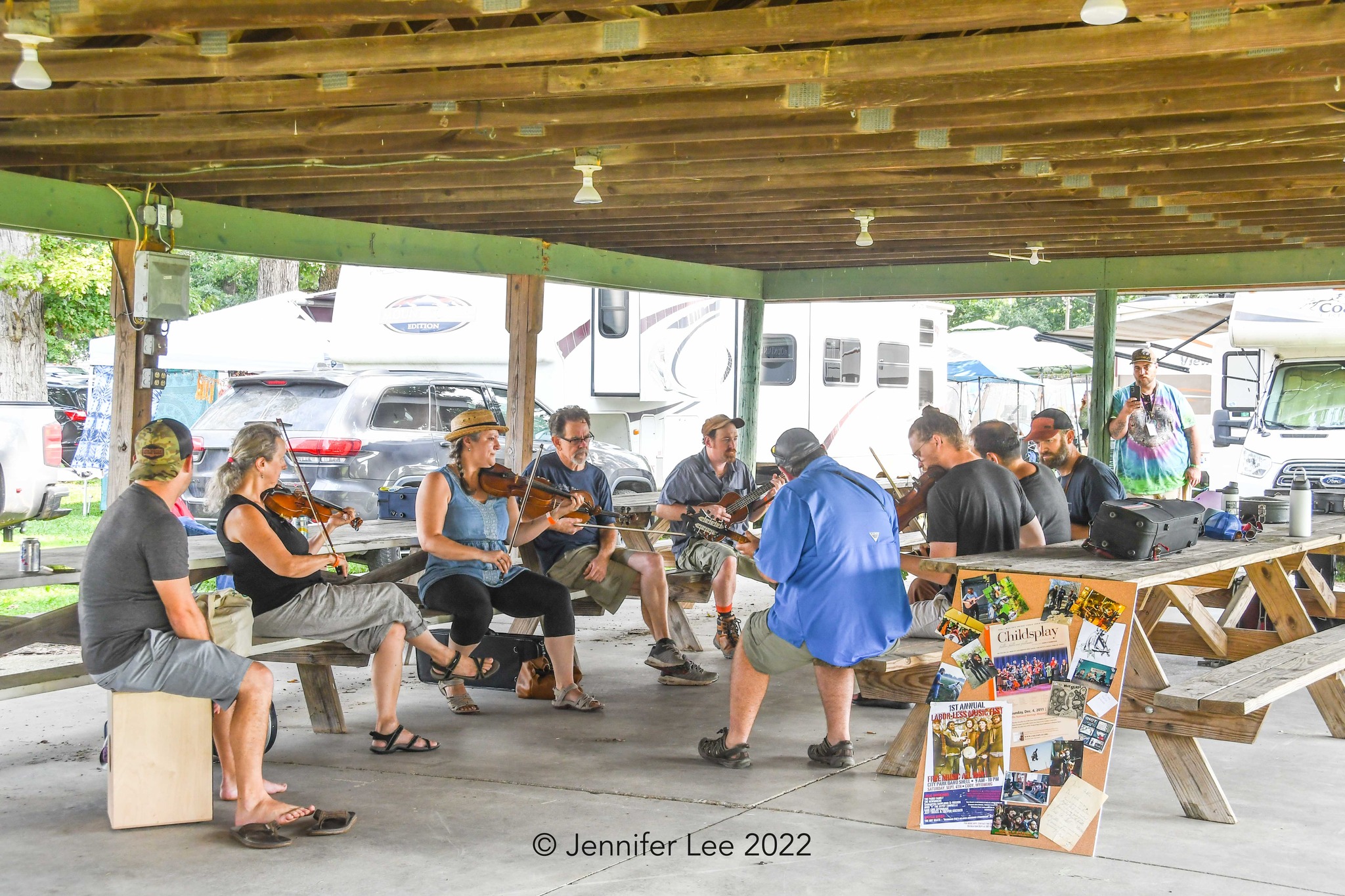 gram dezarn jam musicians jamming together under the pick-nic shelter at the Wateremlon Pickers' Fest.