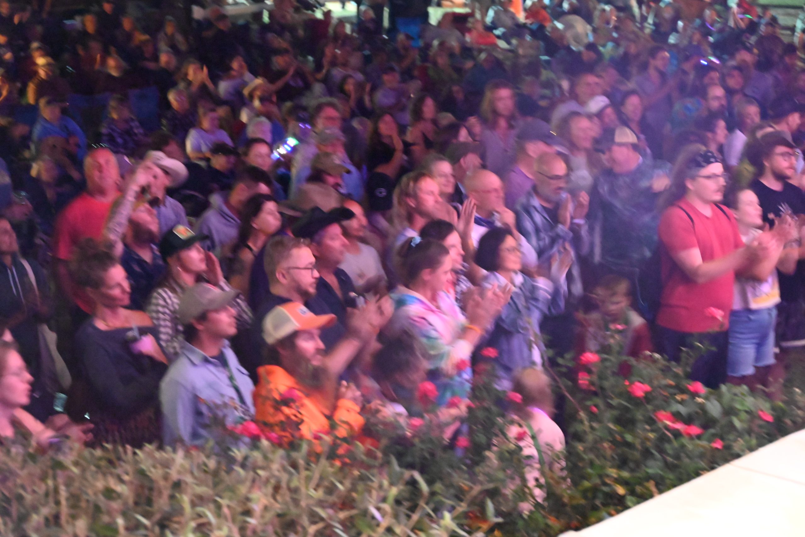 Happy Crowd – photo by Kevin Slick A happy crowd dances in fromt of the mainstage at night at the Watermelon Pickers' Fest
