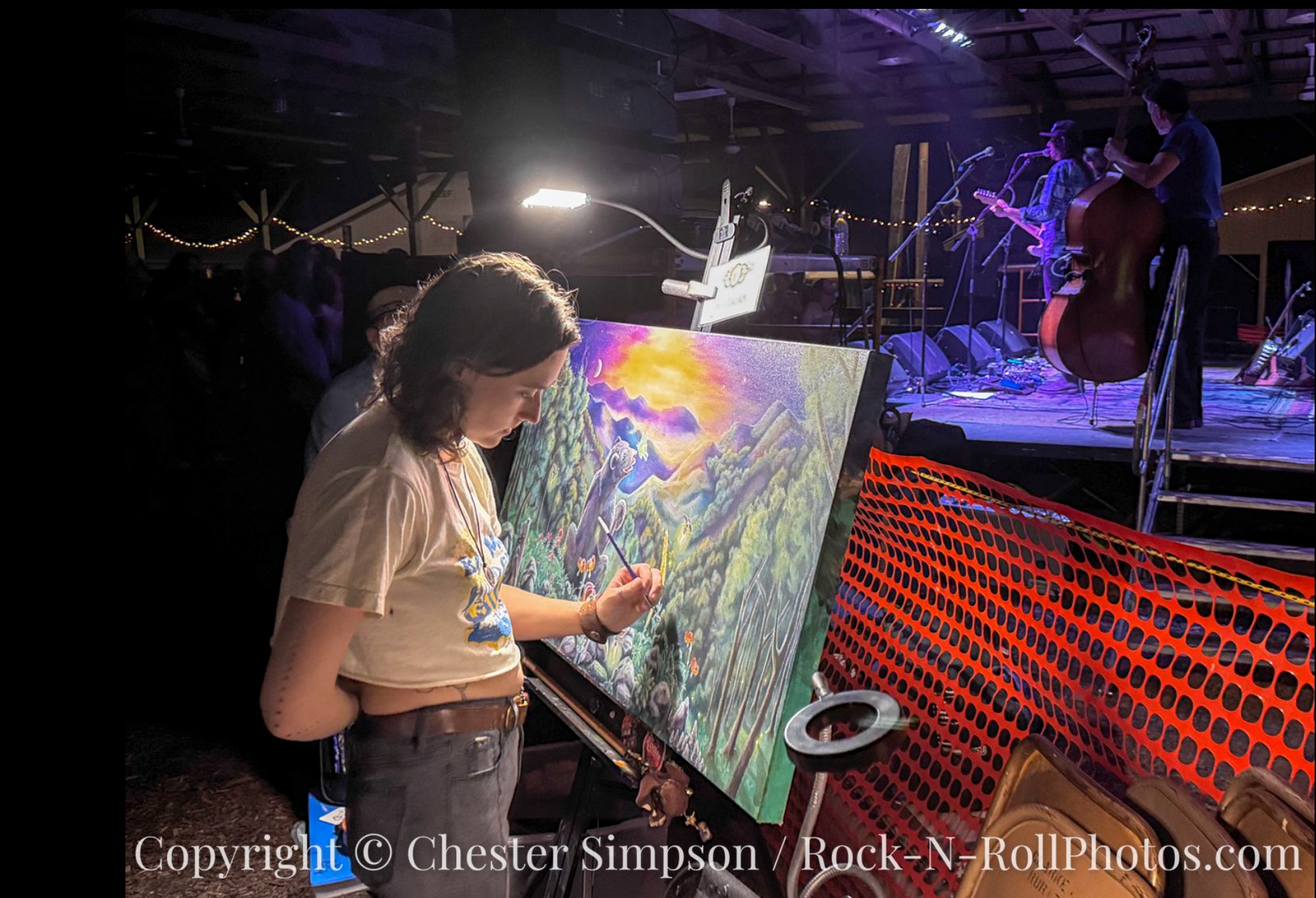 Live Painting – photo by Chester Simpson A live painter creating her artwork beside the dance barn stage